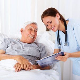 nurse showing senior man a document