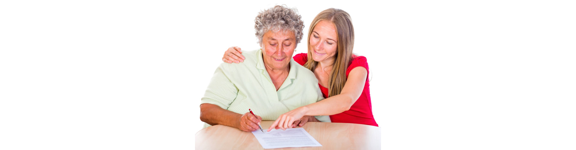 caregiver helping senior woman filling up a form